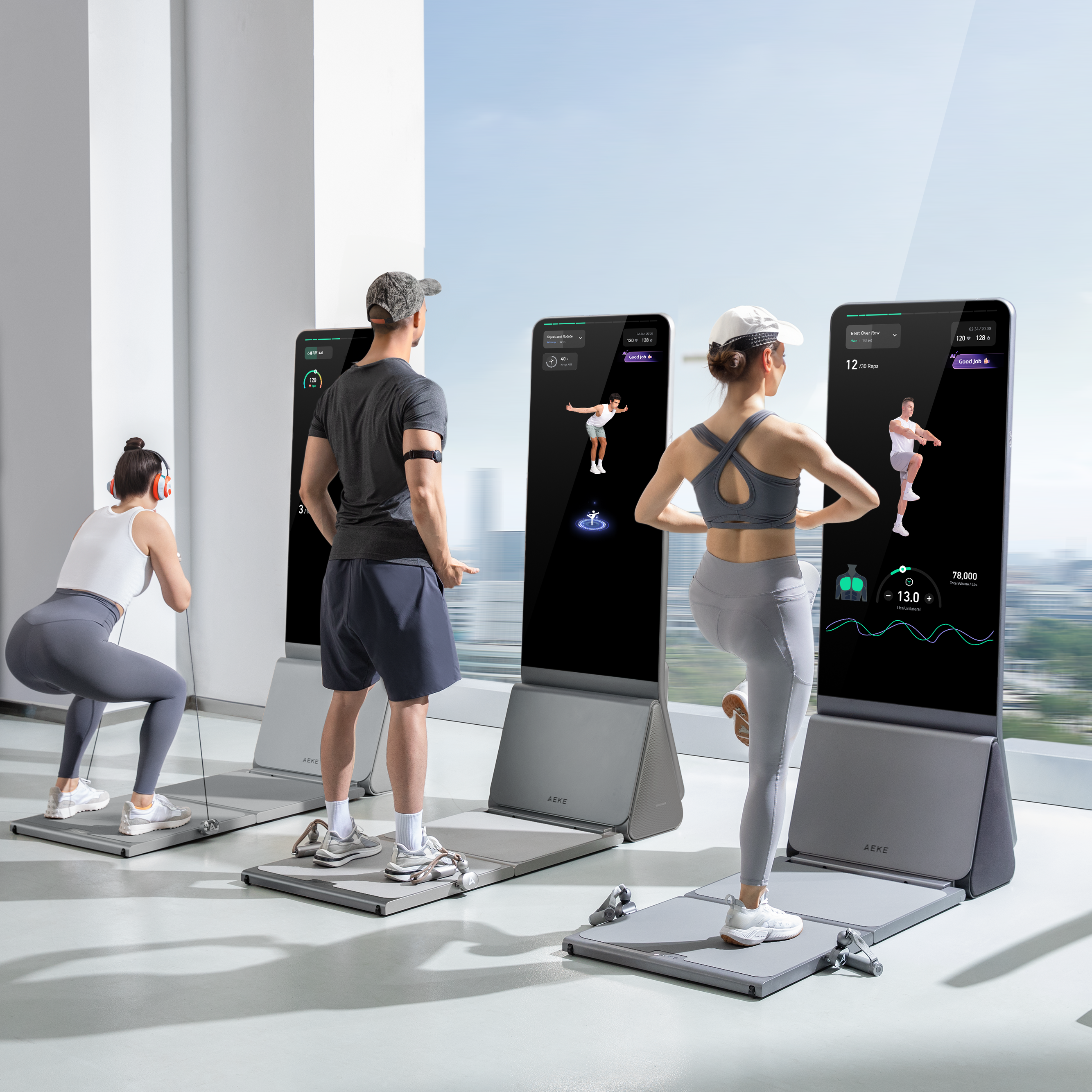 A group of people wearing athletic gear and headphones perform various exercises while interacting with individual smart fitness mirrors in a bright, modern studio.